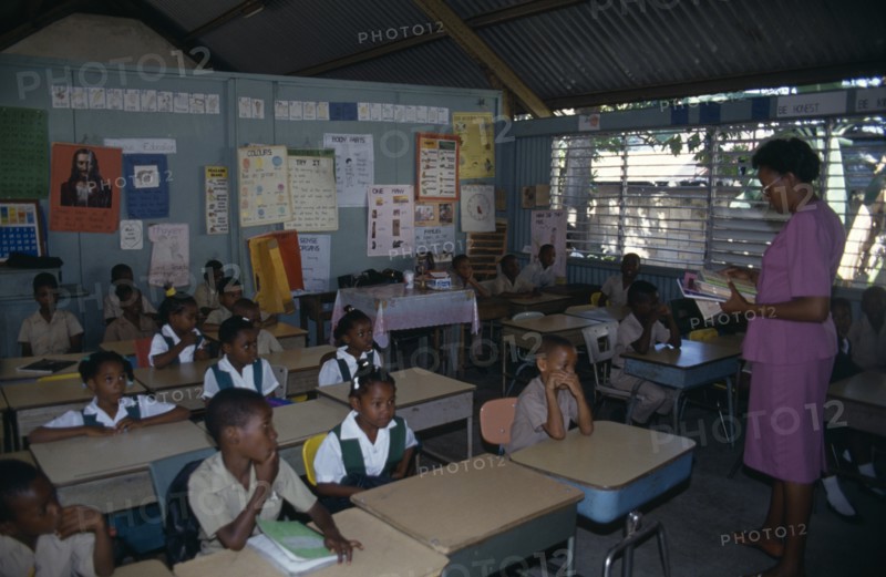 West Indies, Jamaica, Falmouth, First Grade pupils in classroom with female teacher. Photo : Nancy Durrell McKenna