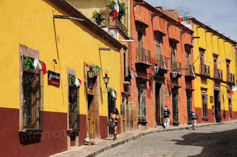 Mexico, Bajio, San Miguel de Allende, Independence Day decorations adorn colonial streets lined by brightly painted buildings. Photo : Nick Bonetti