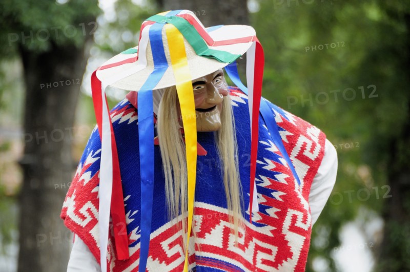 Mexico, Michoacan, Patzcuaro, Dancer in mask and costume performing Danza de los Viejitos or Dance of the Little Old Men in Plaza Vasco de Quiroga. Photo : Nick Bonetti