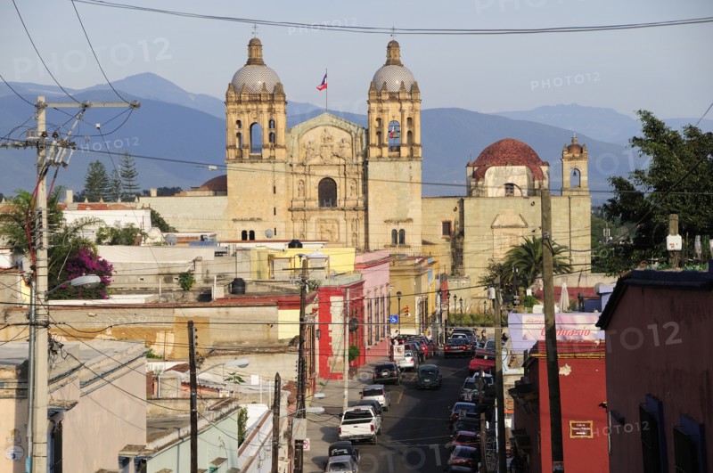 Mexico, Oaxaca, View towards church of Santo Domingo over street and rooftops of surrounding buildings. Photo : Nick Bonetti
