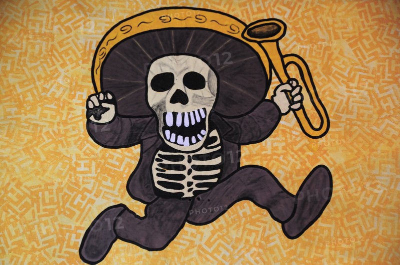 Mexico, Bajio, Queretaro, Wall art depicting skeleton in sombrero holding a trumpet. Photo : Nick Bonetti