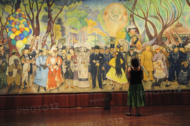 Mexico, Federal District, Mexico City, Visitor looking at Dream of a Sunday Afternoon in the Alameda mural by Diego Rivera in the Museo Mural Diego Rivera.. Photo : Nick Bonetti