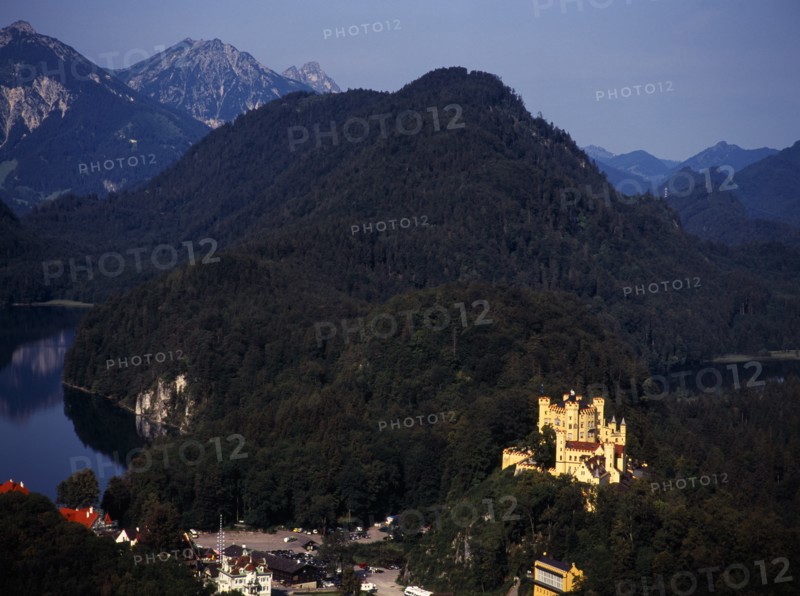 Germany, Bayern, Schwangau, View looking down on town overlooked by Schloss Hohenschwangau and Alpsee. Photo : Bryan Pickering