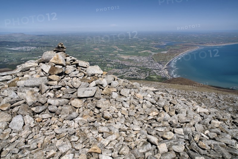 Ireland, County Down, Mourne Mountains, A cairn on the summit of Slieve Donard with Newcastle and its beach in the background. Photo : Hugh Rooney