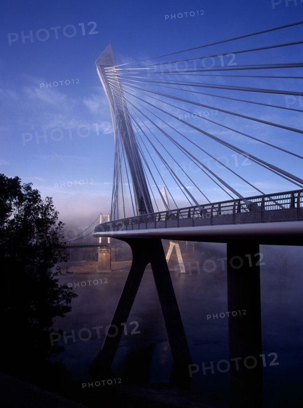 France, Bretagne, Finistere, Ile de Crozon. The new Pont de Terenez suspension bridge. View of east side with old bridge part seen beyond from north bank of the River Aulne. Photo : Bryan Pickering