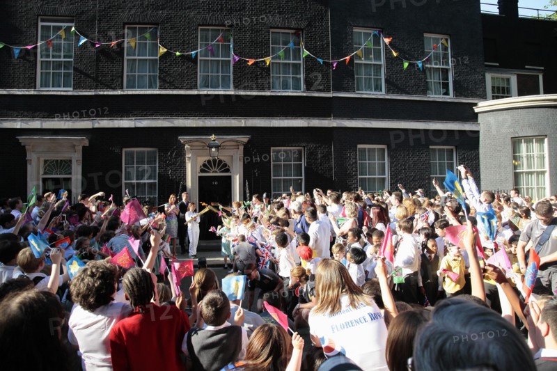 England, London, Olympic Torch relay in Downing Street Samantha and Prime Minister David Cameron welcome the torch. Photo : Sean Aidan