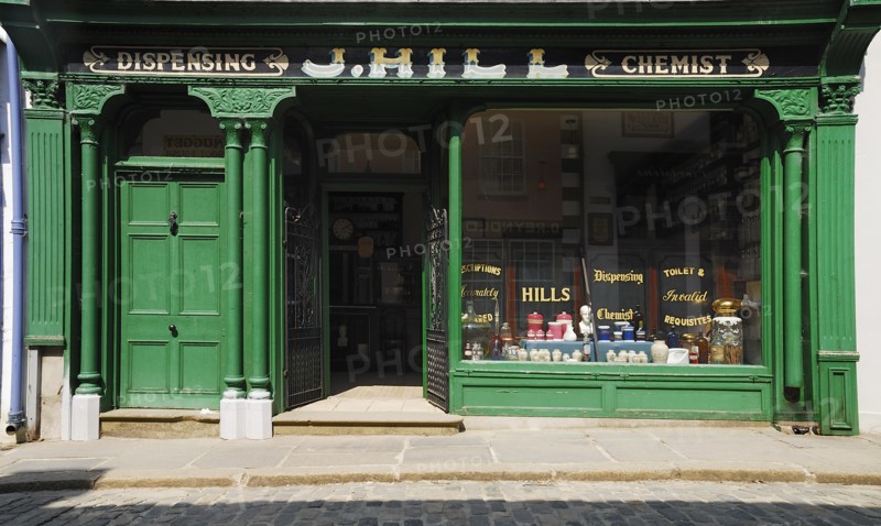 Ireland, County Tyrone, Omagh, Ulster American Folk Park 19th century street Hills chemist shopfront. Photo : Hugh Rooney