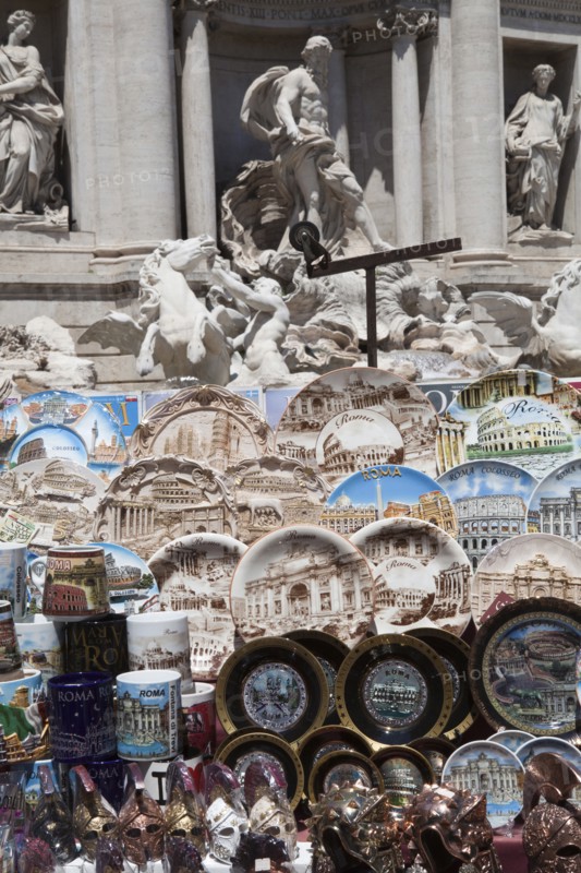 Italy, Lazio, Rome, Display of tourist souvenir gifts beside the baroque Trevi Fountain by Nicola Salvi 1762 against the Palazzo Poli. Photo : Bennett Dean