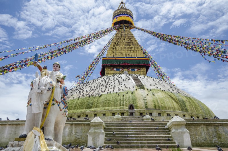 Nepal, Kathmandu, Boudhanath Stupa Five-color prayer flags and symbolic sculptures with mantras. Photo : Sergey Orlov