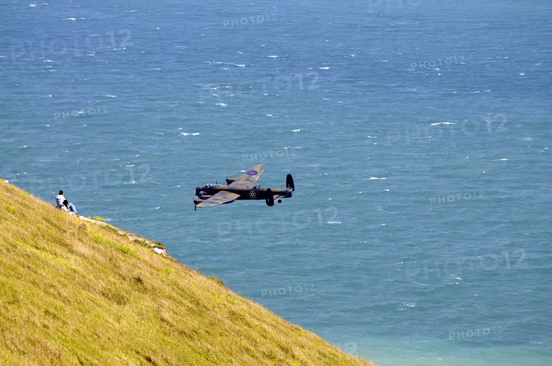 England, East Sussex, Beachy Head, Lancaster bomber taking part in the Airbourne air show. Photo : Bob Battersby