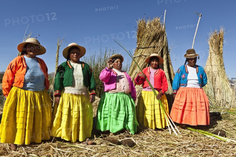 Peru, Puno, Lake Titicaca Women in colorful clothing on Grass Island. . 
Photo Richard Rickard / Eye Ubiquitous