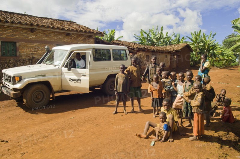 Rwanda, Children, Group of children on road beside a development project vehicle. 
Photo Nic I Anson / Eye Ubiquitous