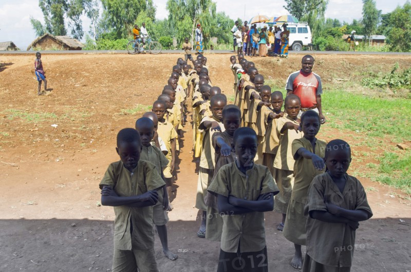 Burundi, Cibitoke Province, Buganda, Ruhagurika Primary Students lining up ready to go into their Catch-Up Class. Catch up classes were established by Concern Worldwide across a number of schools in Cibitoke to provide a second chance for children who had previously dropped out of school. 
Photo Nic I Anson / Eye Ubiquitous