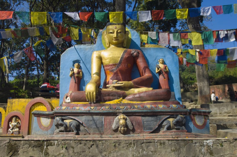 Nepal, Kathmandu, Buddha statue at the foot of the Swayambunath Monkey Temple. 
Photo Nic I Anson / Eye Ubiquitous