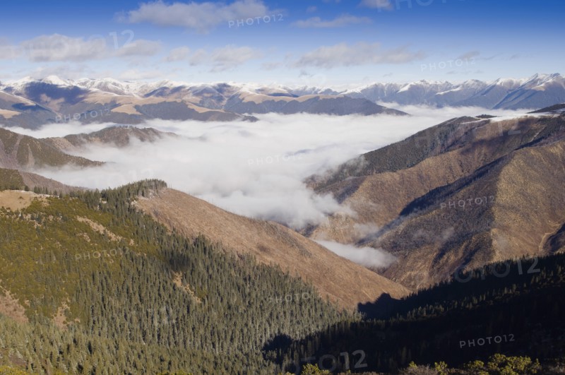 China, Szechuan Province, Tibet, High altitude view across mountains and valleys in Tibetan region of Litang county. 
Photo Nic I Anson / Eye Ubiquitous