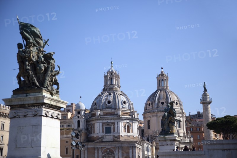 Italy, Lazio, Rome, Statue outside the Victor Emmanuel II monument with Church domes in the background. 
Photo Stephen Rafferty / Eye Ubiquitous
