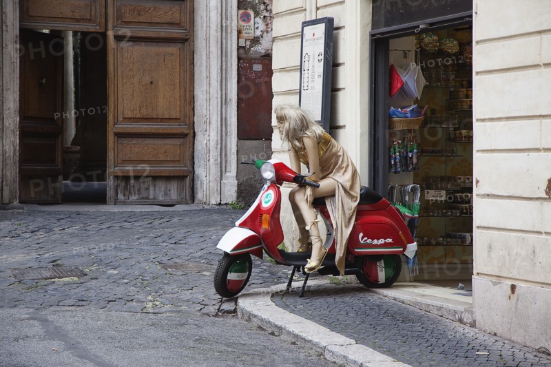 Italy, Lazio, Rome, Mannequin seated on Vespa outside tourist shop. 
Photo Stephen Rafferty / Eye Ubiquitous