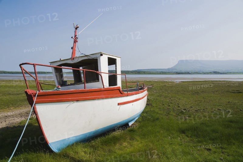 Ireland, County Sligo, Rosses Point, Boat moored on the 3rd beach with Ben Bulben in the background. 
Photo Hugh Rooney / Eye Ubiquitous