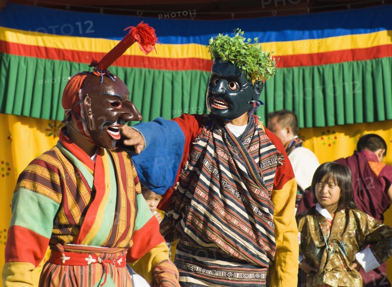 Bhutan, Thimpu Dzong, Two Atsaras, or comedians at a masked dance Tsecchu. 
Photo Nic I'Anson