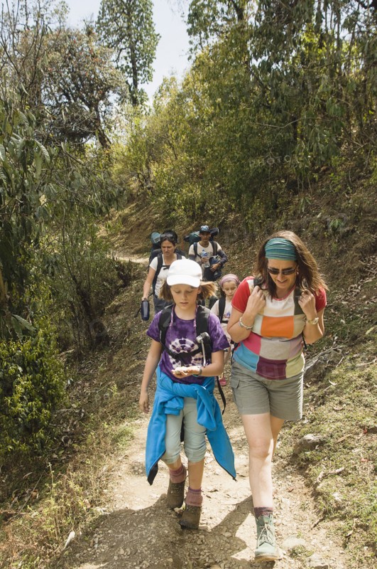Nepal, Himalayas, Pokhara, Western family with children trekking in Nepali Himalayan hills near Pokhara.