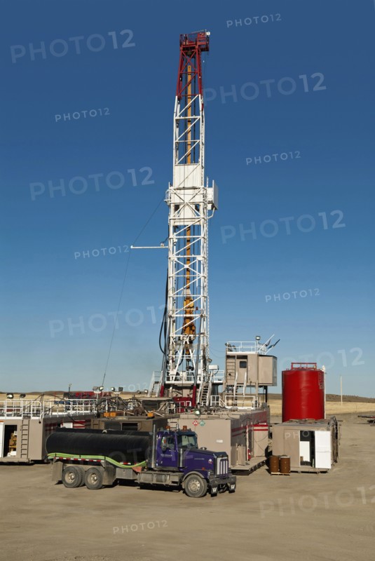 Canada, Alberta, Del Bonita, CanElson Drilling Inc of Calgary fracking for tight shale oil in a wheat field at the edge of the Baaken play.