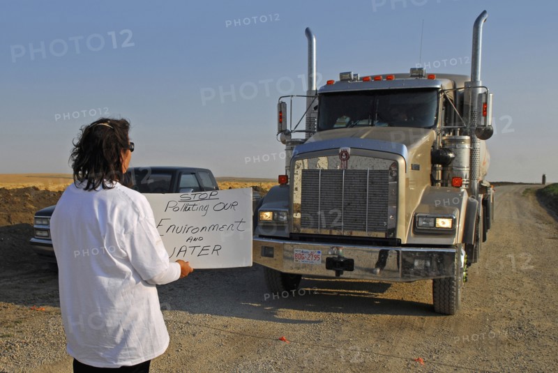 Canada, Alberta, Blood Reserve, Fracking for oil and gas on the Blood Tribe Indian Reserve at the edge of the Bakken Play. Anti-fracking protester Lois Frank blocks a GASFRAC truck engaged in fracking on the Blood Reserve. 
Photo Trevor Page