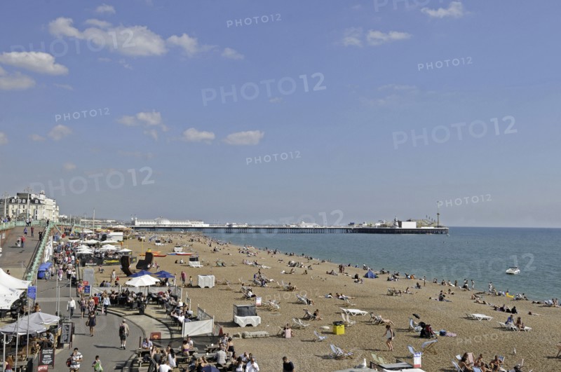 View along the Brighton beach and beachside cafes to Pier Brighton East Sussex England