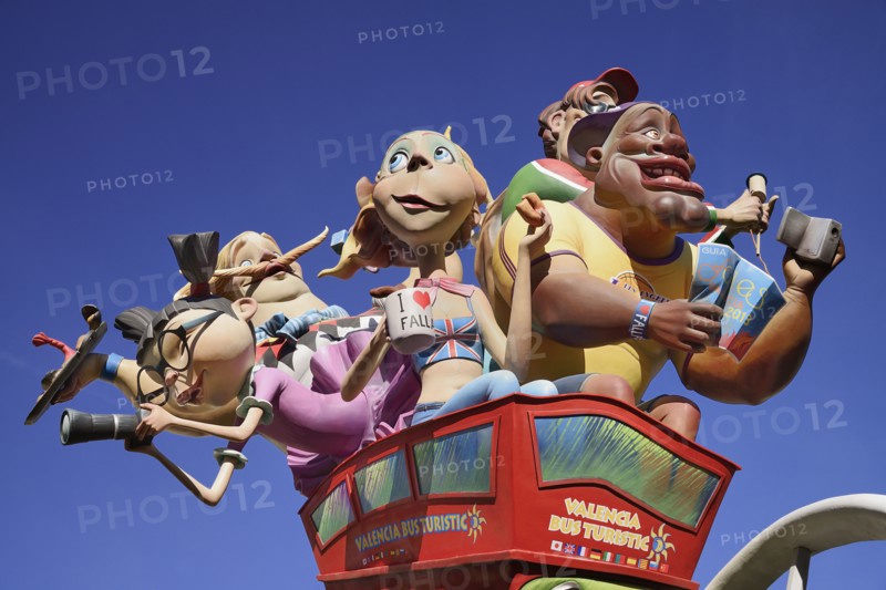 Spain, Valencia Province, Valencia, Las Fallas scene with Papier Mache figures on a Bus Turistic in Plaza Ayuntamiento during Las Fallas festival.