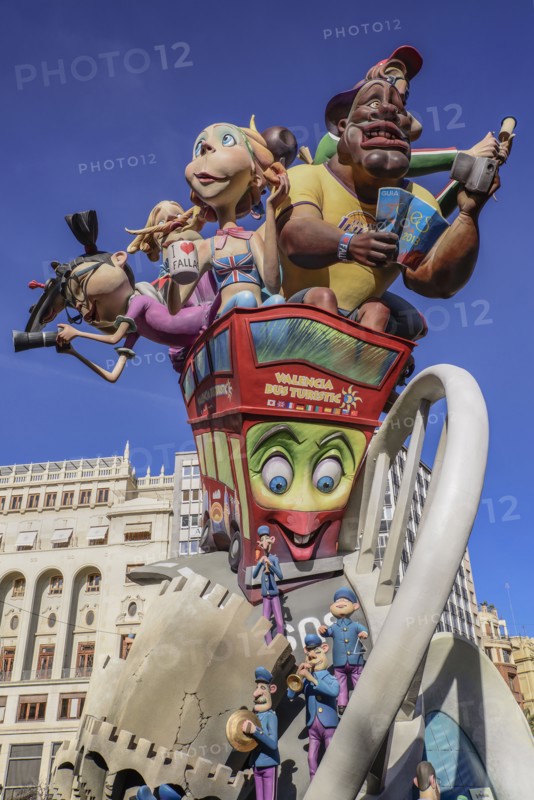 Spain, Valencia Province, Valencia, Las Fallas scene with Papier Mache figures on a Bus Turistic in Plaza Ayuntamiento during Las Fallas festival.