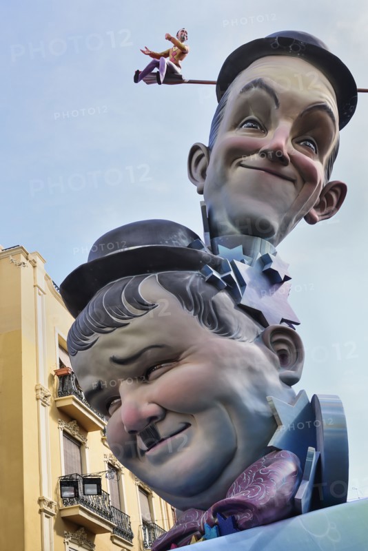 Spain, Valencia Province, Valencia, Papier Mache versions of Laurel and Hardy in the street during Las Fallas festival. 
Photo Hugh Rooney