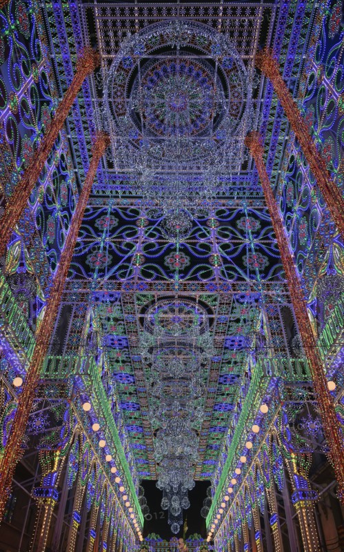 Spain, Valencia Province, Valencia, Street illuminated for Las Fallas festival. 
Photo Hugh Rooney