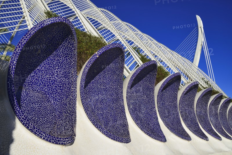 Spain, Valencia Province, Valencia, La Ciudad de las Artes y las Ciencias  City of Arts and Sciences  Arches of the Umbracle sculpture garden with El Pont de lAssut de lOr bridge in the background.