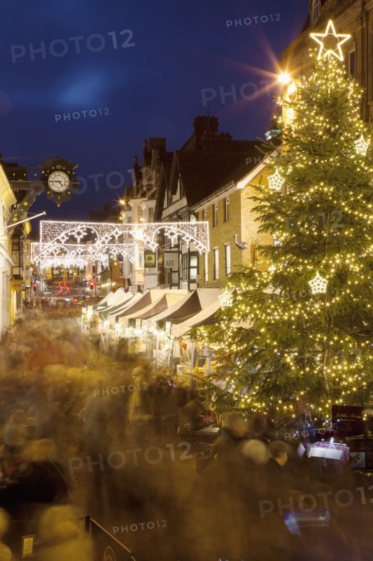 England, Hampshire, Winchester, High street decorated with Christmas tree and decorations, seen from the Buttercross.