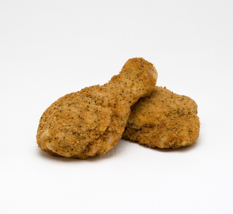 Food, Cooked, Poultry, Two breaded chicken drumsticks on a white background.