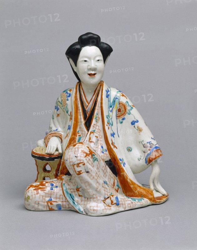 Statuette représentant une courtisane assise
