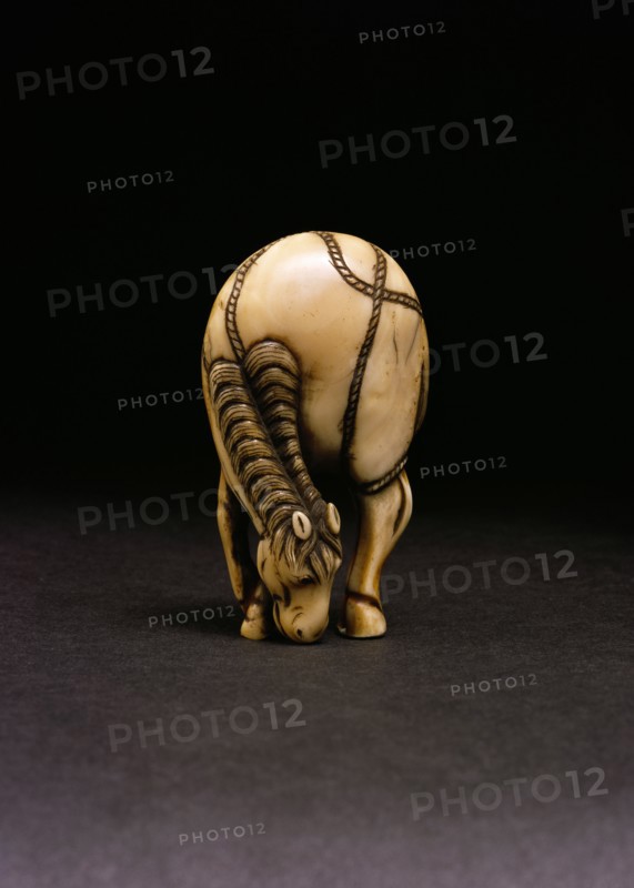 Netsuke of a grazing horse. Japan, 18th century