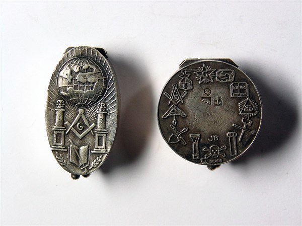 Silver pillboxes with Masonic motifs.