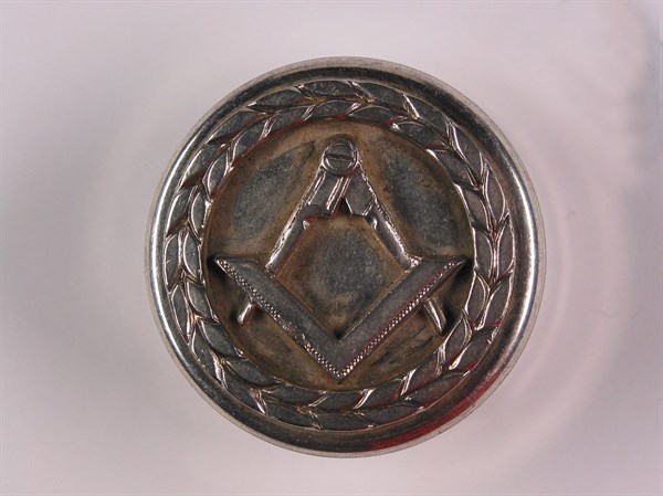 Silver case with Masonic motif.