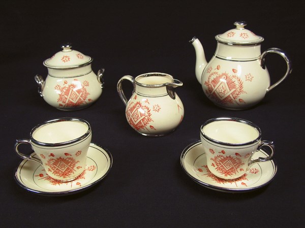 Faience tea set (teapot, sugar bowl, milk jug).