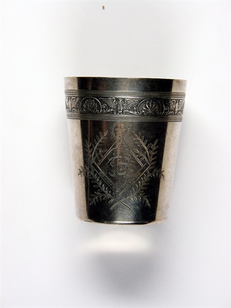 Silver-plated metal beaker engraved with Masonic motifs.