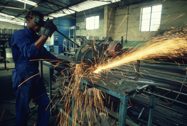 Man using a metal drop saw
\n