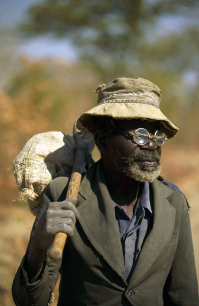 ELDERLY ZIMBABWEAN MAN WITH "DO IT YOURSELF" SPECTACLE REPAIRS, ZIMBABWE