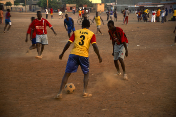 In the suburb of Corofina Nord, Bamako, Mali, young people gather in the late afternoon at a large