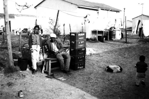 Langa, Cape Town, South Africa, 1989
young xhosa  boys, men,  black townships, dog, dogs,