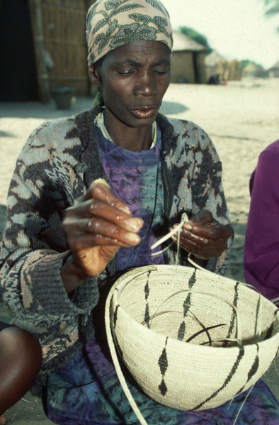 Lady weaving a basket