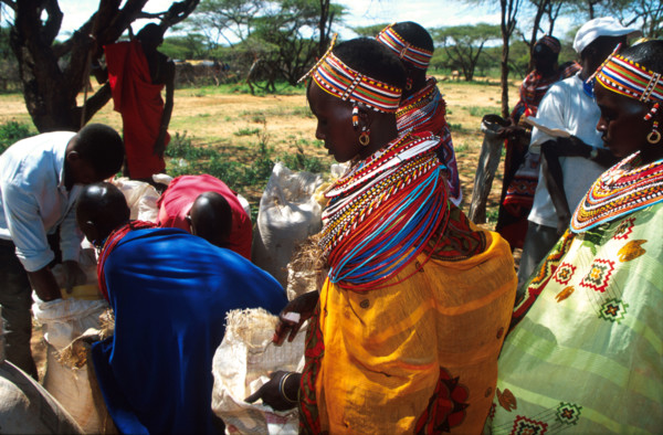 Young Samburu women stand in line waiting to get food from aid workers with EdFri International at Lkisin some kilometres down a dirt track outside the town of Wamba