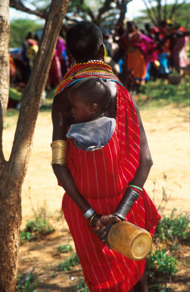 A Samburu child on his mother