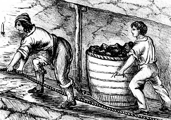 Woman and boy underground in coal mine drawing cart containing 3-4 cwt of coal - Bolton, Lancashire