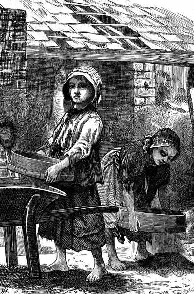 Barefoot girls sifting dust in a brickyard