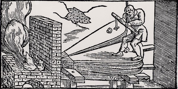 Man operating bellows to increase the draught to a furnace